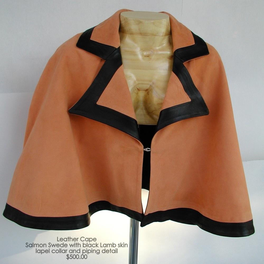 Pastel apricot Swede cape and black lamb skin trim